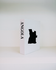 White box with black silhouette of Angola and 'ANGOLA' text on a white background