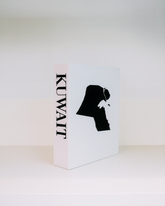 White box with black silhouette of Kuwait on a white background