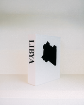 White card with black silhouette of Libya and 'LIBYA' text on a white background