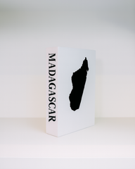 White box with a black silhouette of Madagascar and 'Madagascar' text on a white background