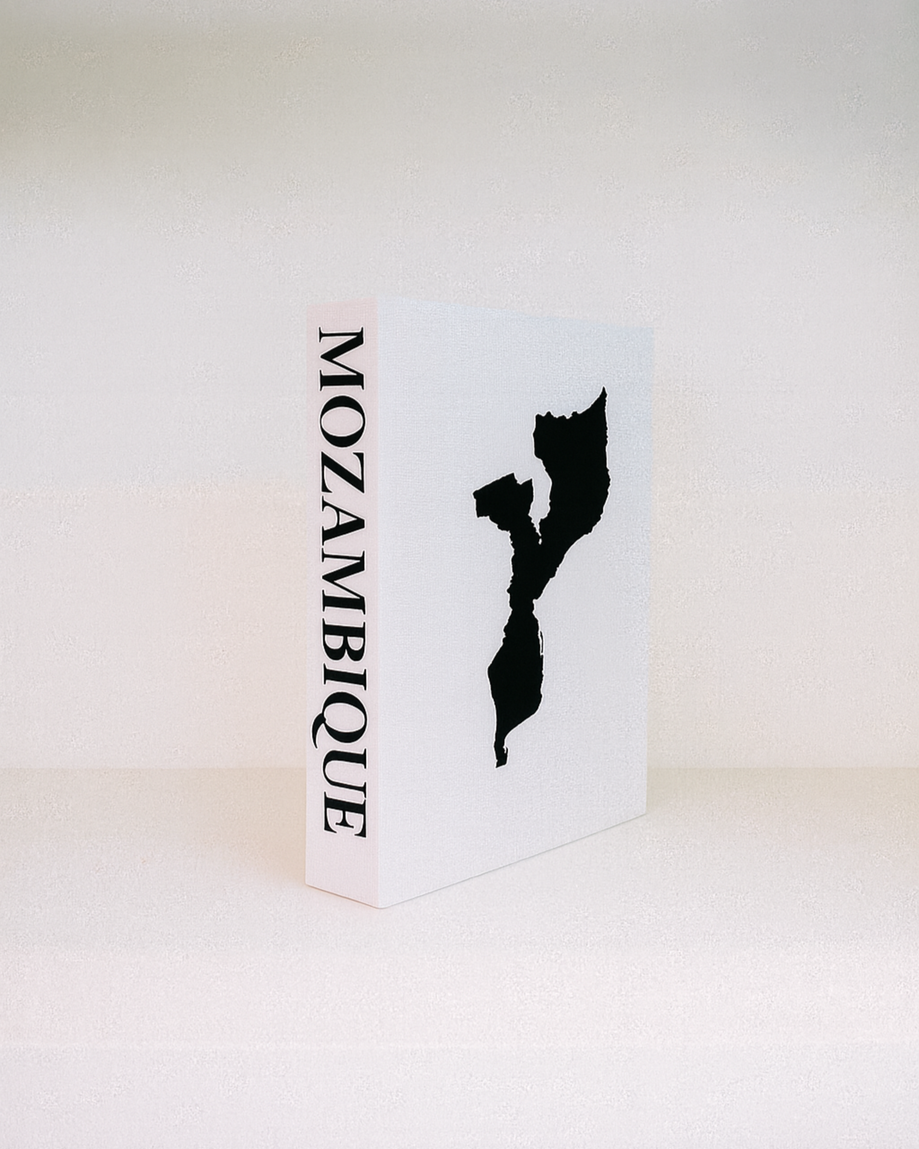 Card with a black outline of Mozambique on a white background