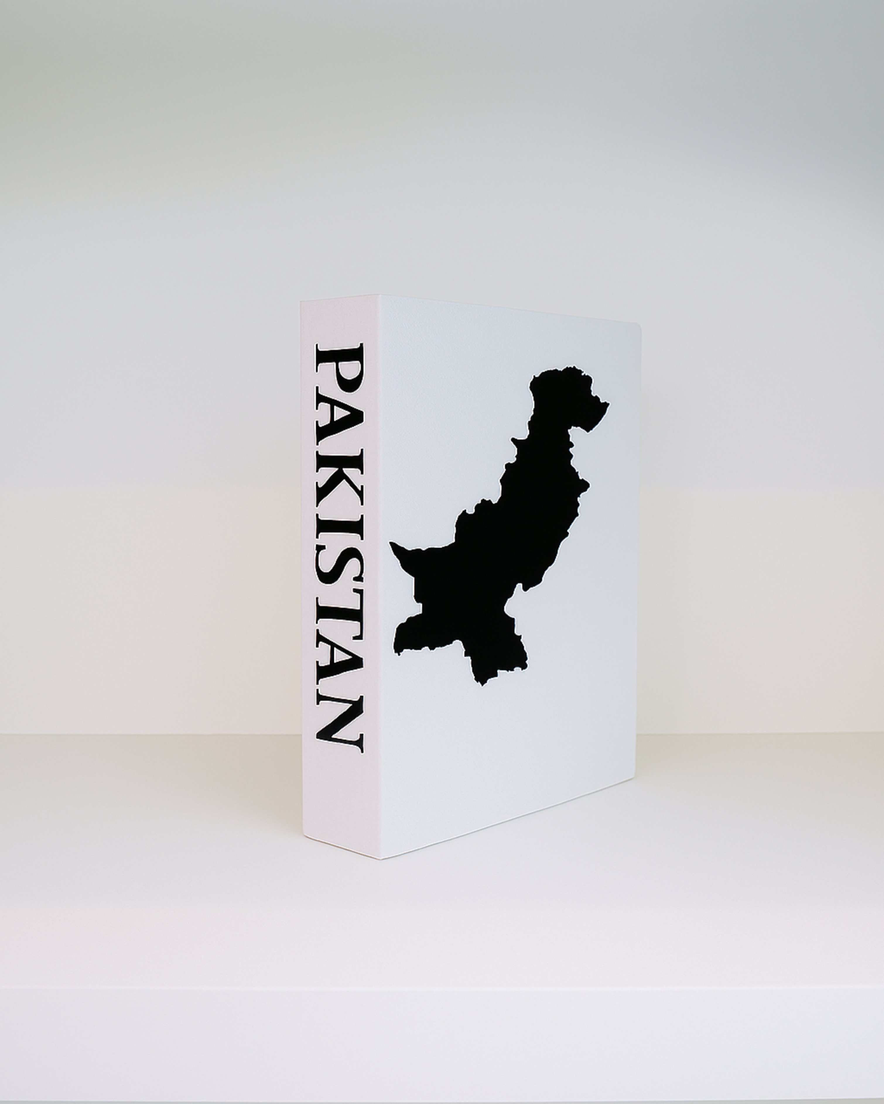 White book with black map of Pakistan on a white background