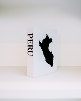 White box with black silhouette of Peru and 'PERU' text on a white background
