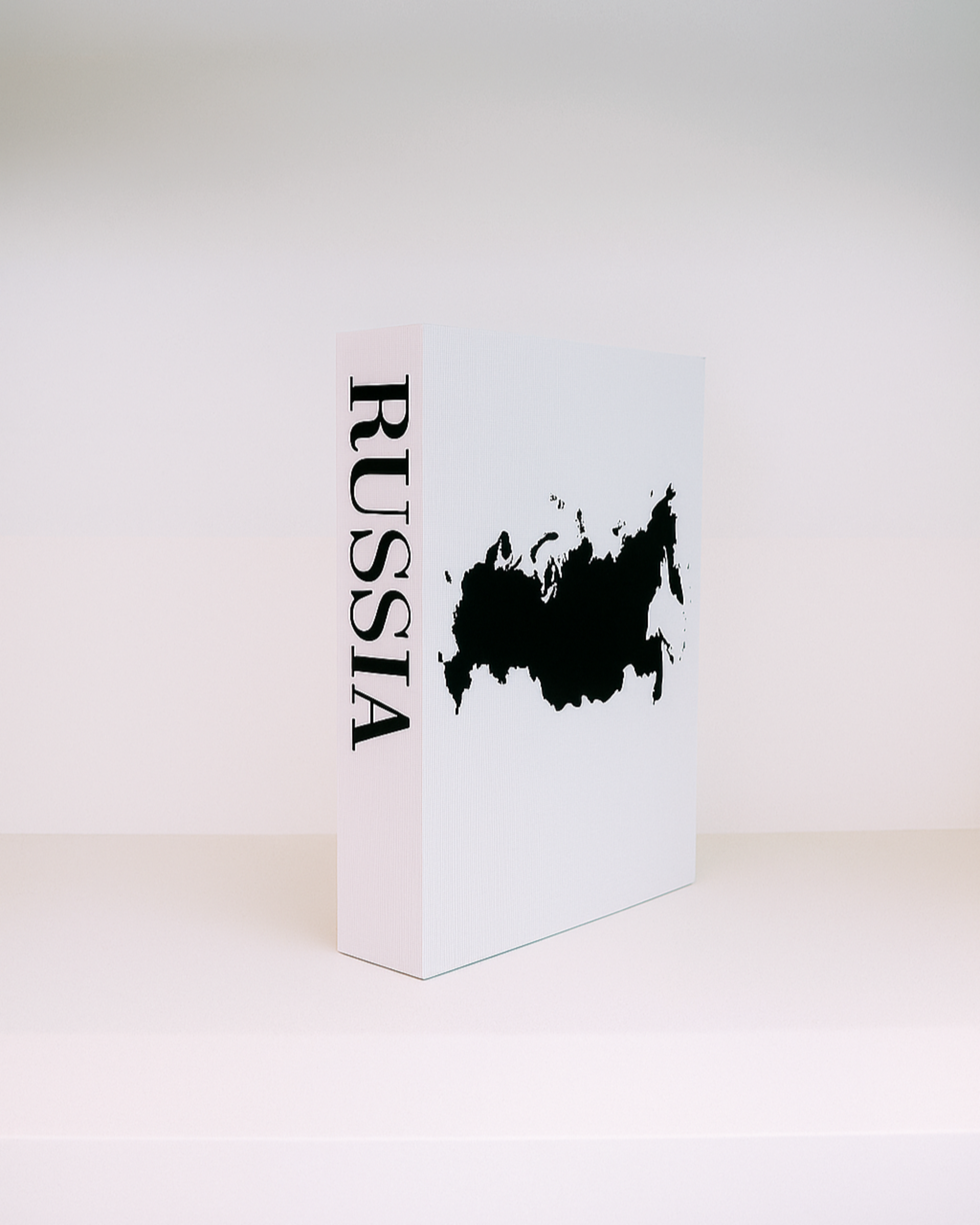 White box with black 'RUSSIA' text and map on a white background