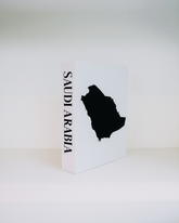 White box with black silhouette of Saudi Arabia and 'SAUDI ARABIA' text on a white background
