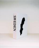 White box with black silhouette of Sweden and 'SWEDEN' text on a white background