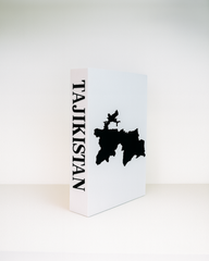 White box with black map and 'Tajikistan' text on a white background