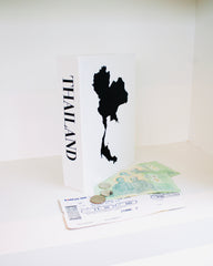 Map of Thailand with a passport and money on a white background