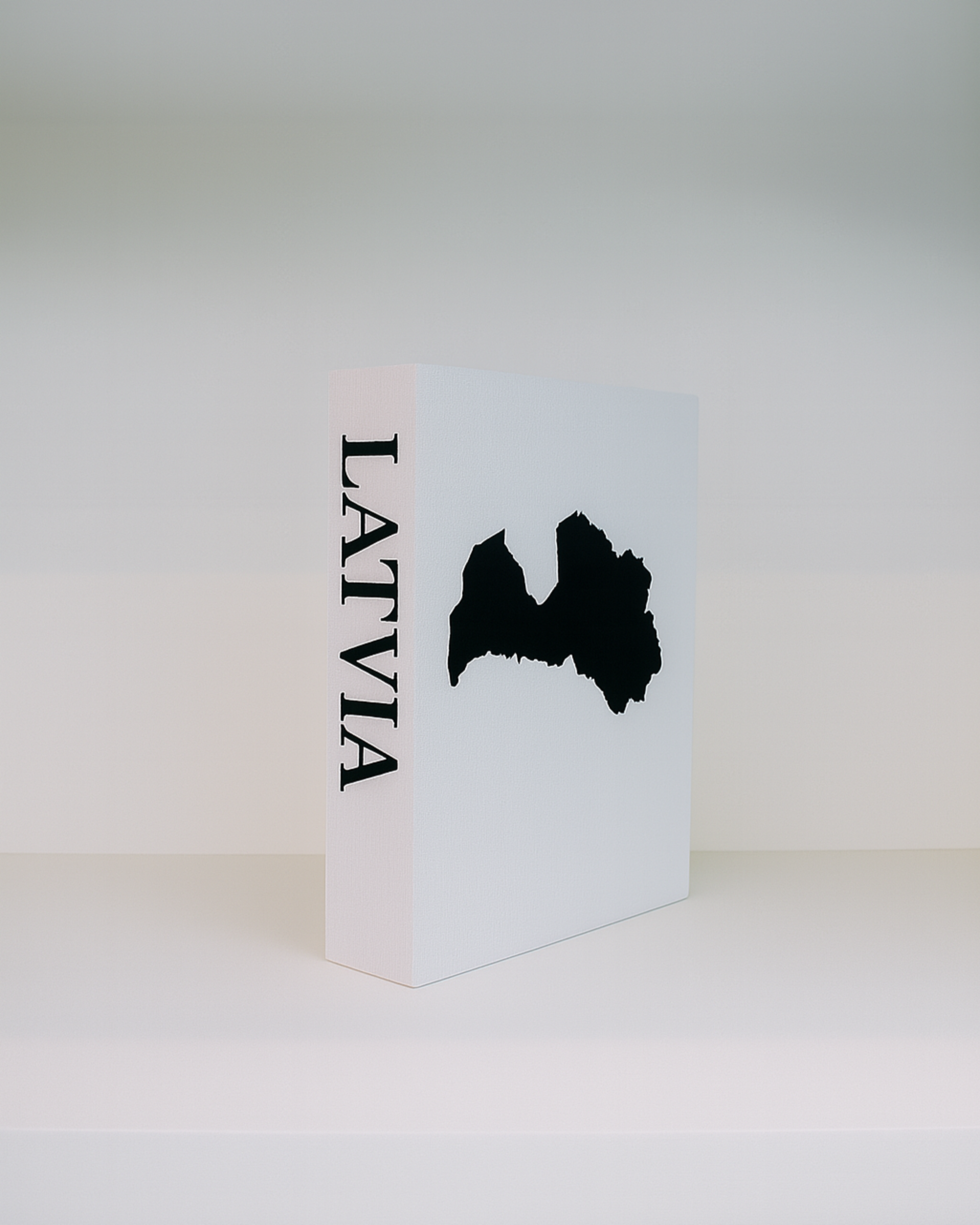White box with black Latvia map and text on a white background