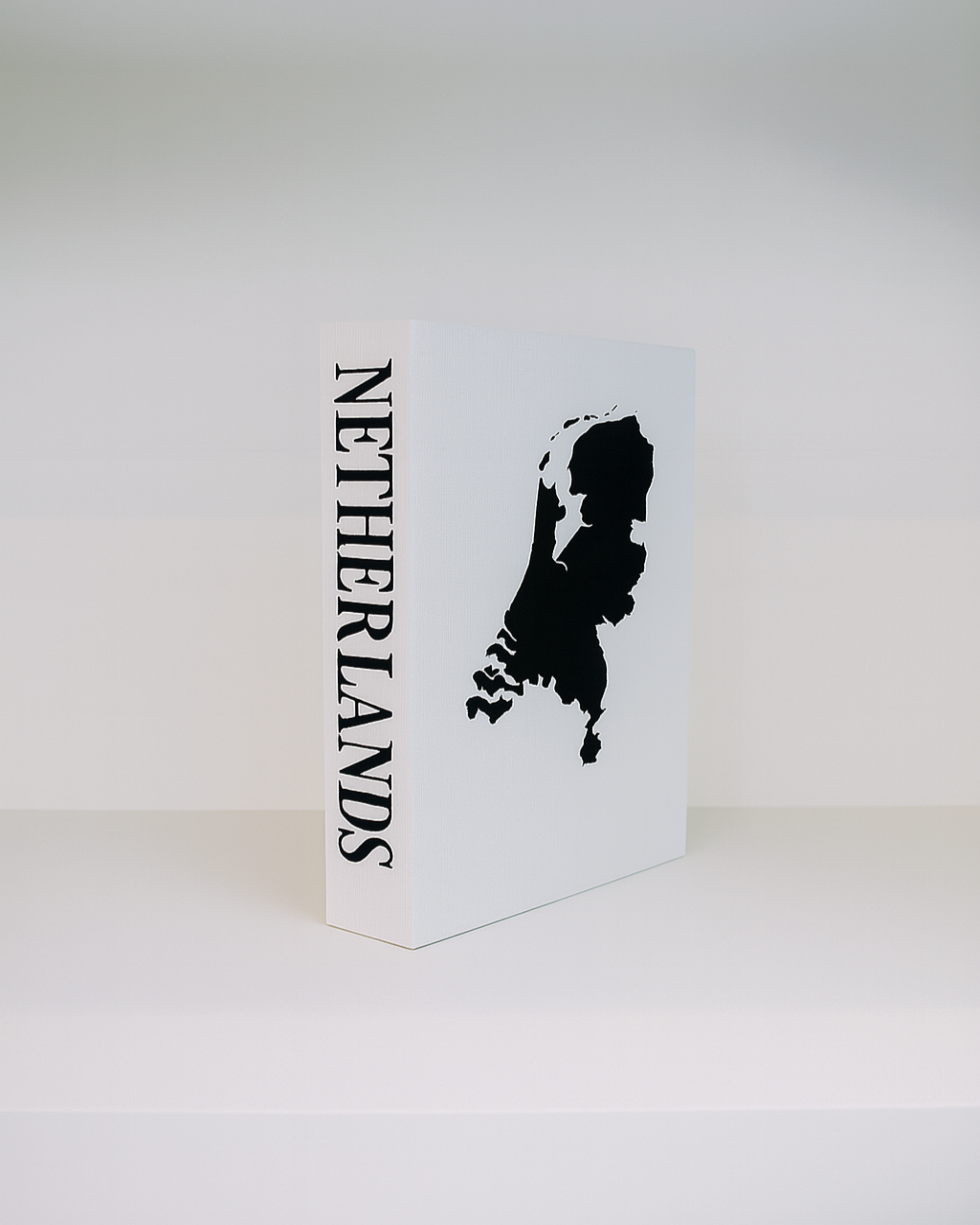 Card with a black silhouette of the Netherlands and 'Netherlands' text on a white background