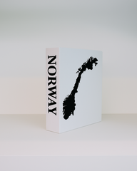 White book with black silhouette of a mountain and 'Norway' text on a white background