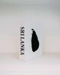 White box with black silhouette of a lion and 'Srilanka' text on a white background