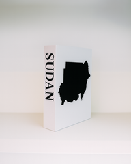White box with black 'SUDAN' text and map on a white background
